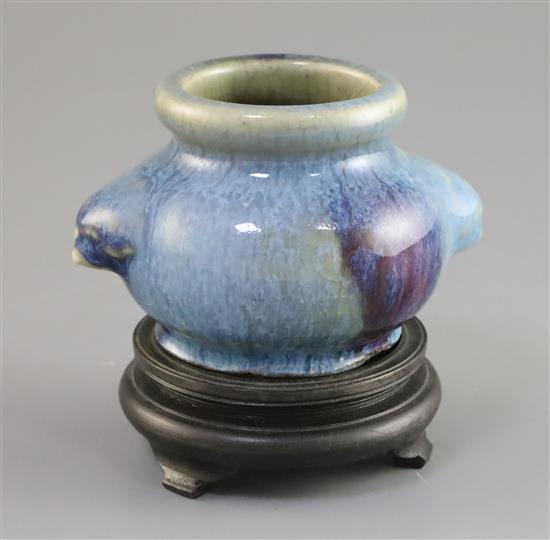 A Chinese Junyao type purple splashed jar, Qing dynasty, W. 10.3cm, wood stand